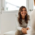 physical therapist talking to patient