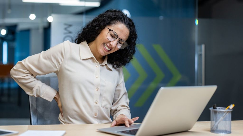 a woman with stomach pain because of bad posture