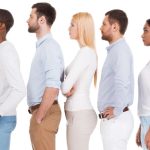 a line of people with good posture standing in a row