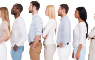 a line of people with good posture standing in a row