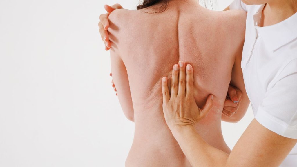 a woman receiving scoliosis treatment