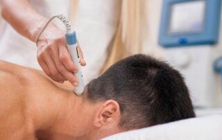 Deep tissue laser therapy treatment being performed for pain relief and muscle recovery