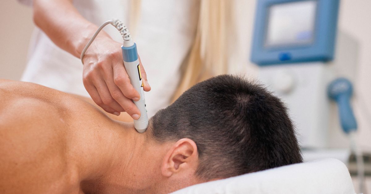 Deep tissue laser therapy treatment being performed for pain relief and muscle recovery