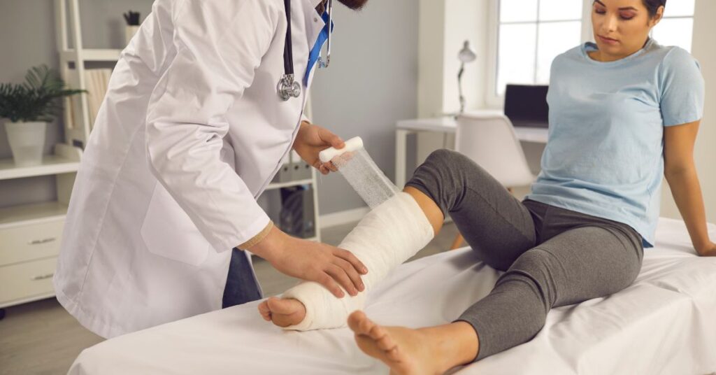 Lower Leg Injury Rehabilitation by Injury Specialist - Premier Therapy Boca Raton Injury specialist treating a lower leg injury with professional rehabilitation techniques