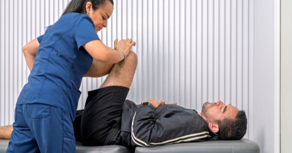 Physical Therapy Treatment by Injury Specialist - Premier Therapy Boca Raton Injury specialist performing physical therapy techniques to restore strength and range of motion