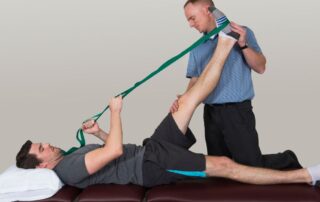 Post operative physical therapy session focusing on leg rehabilitation after surgery