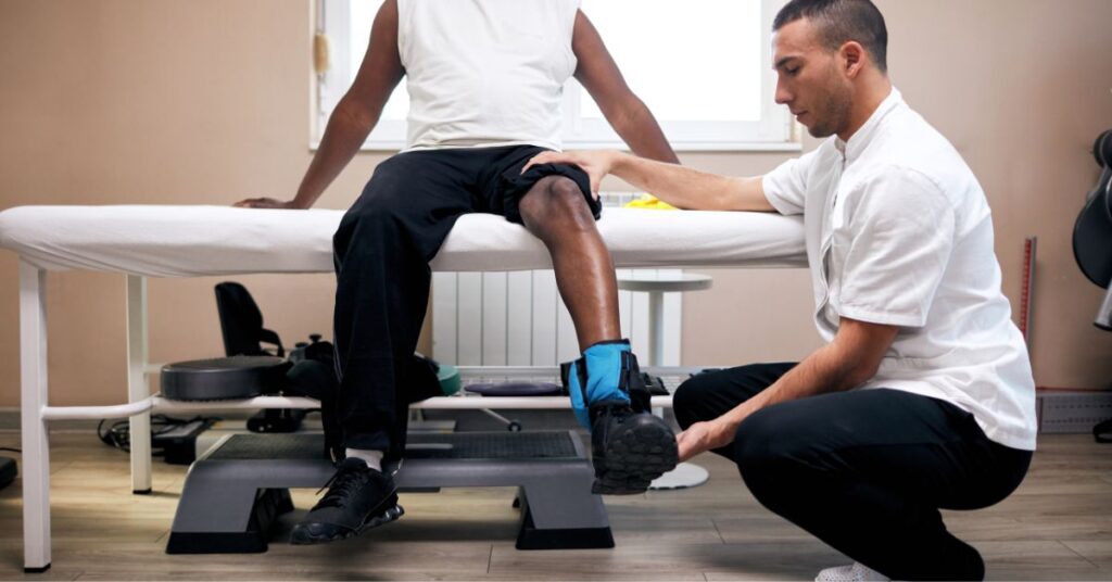 Post Operative Physical Therapy for Leg Rehabilitation - Premier Therapy Boca Raton Physical therapist assisting a patient with post operative leg rehabilitation exercises
