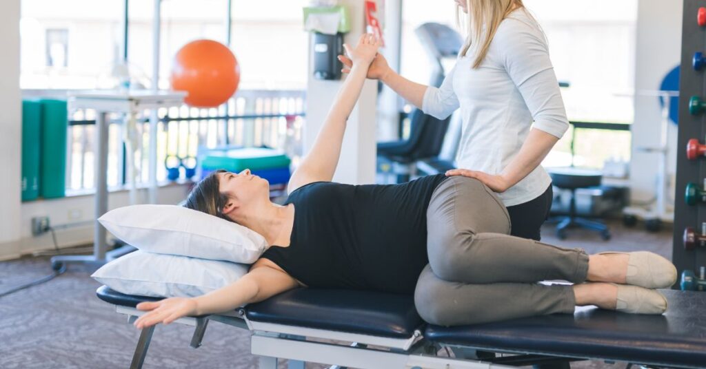 Guided Stretching in Post Surgical Physical Therapy - Premier Therapy Boca Raton Patient performing guided stretching during post operative physical therapy session
